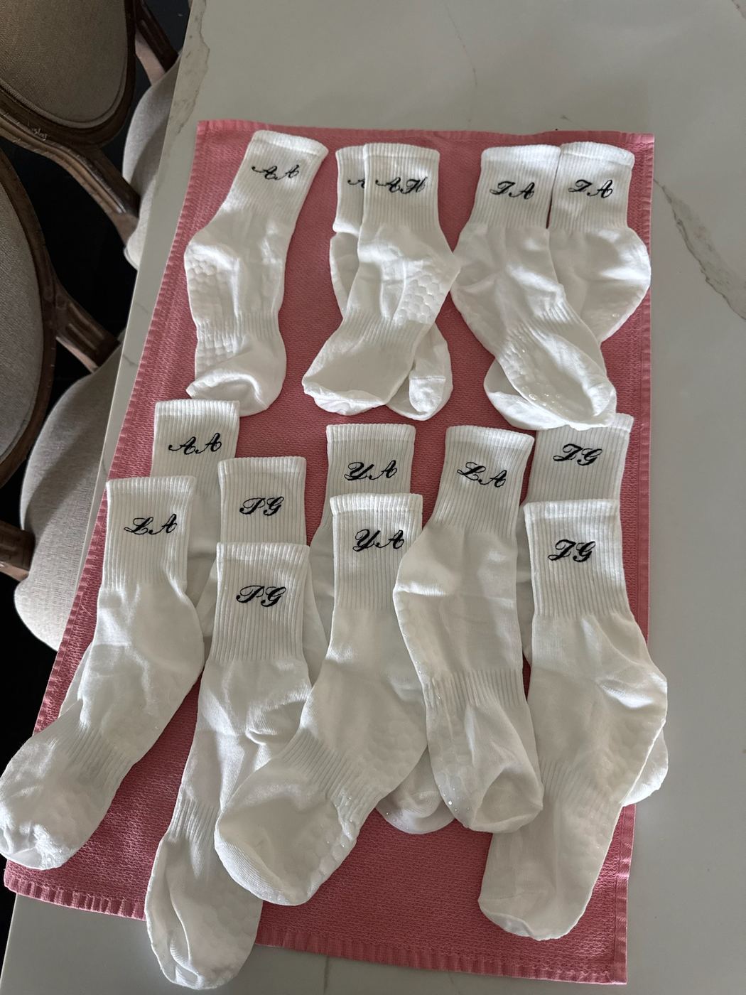 Set of crew socks each embroidered with a different two-letter monogram
